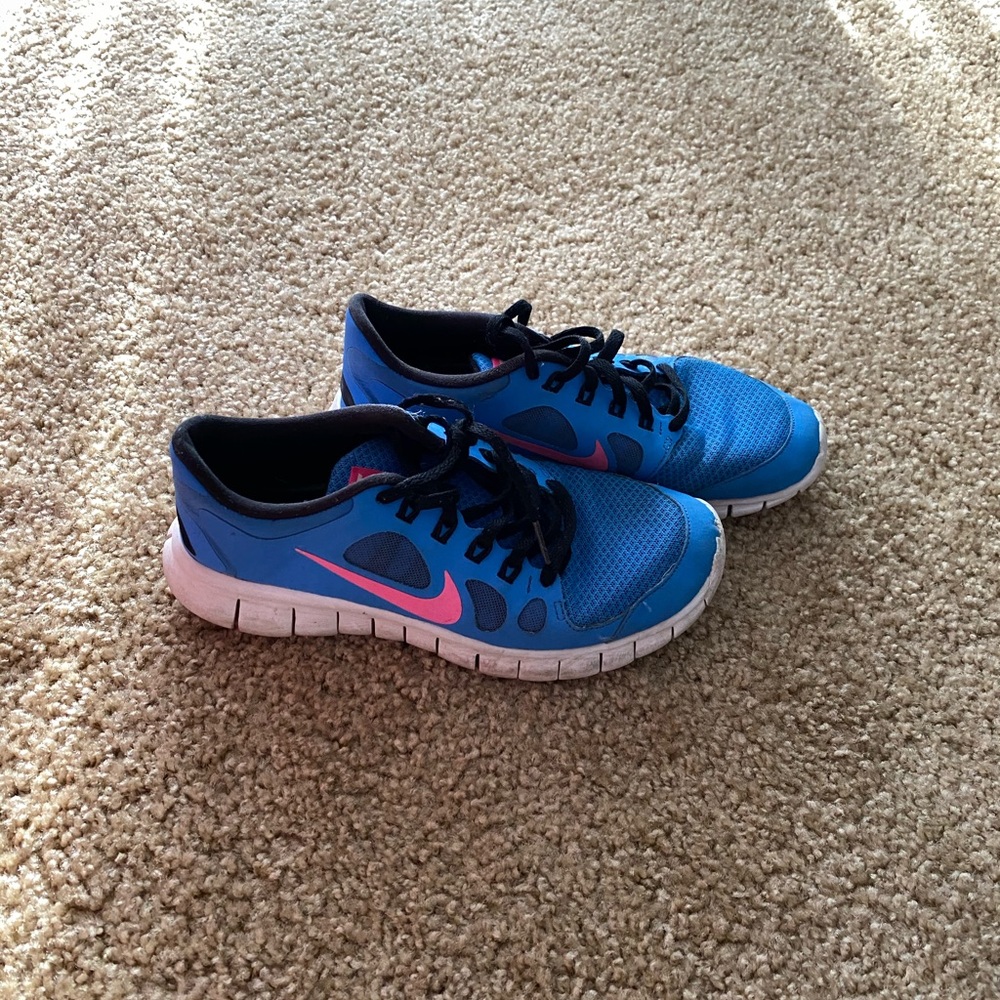 Blue Nike running shoes